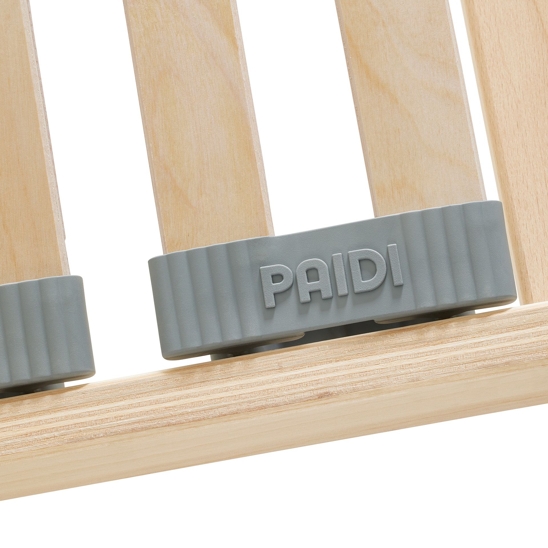 Lattenrost  Comfort mit Härteverstellung in 90 x 190 cm Nahaufnahme eines grauen Kunststoffteils mit der Aufschrift PAIDI auf hellen Holzlatten.