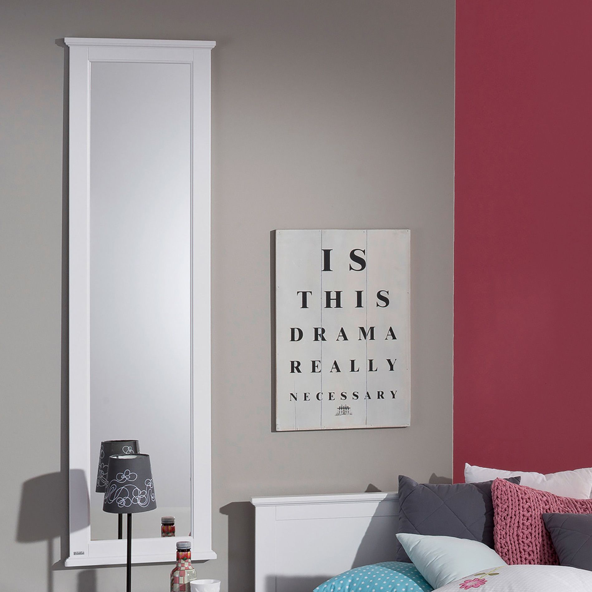 Bedroom wall with a tall mirror and a sign reading Is this drama really necessary?.