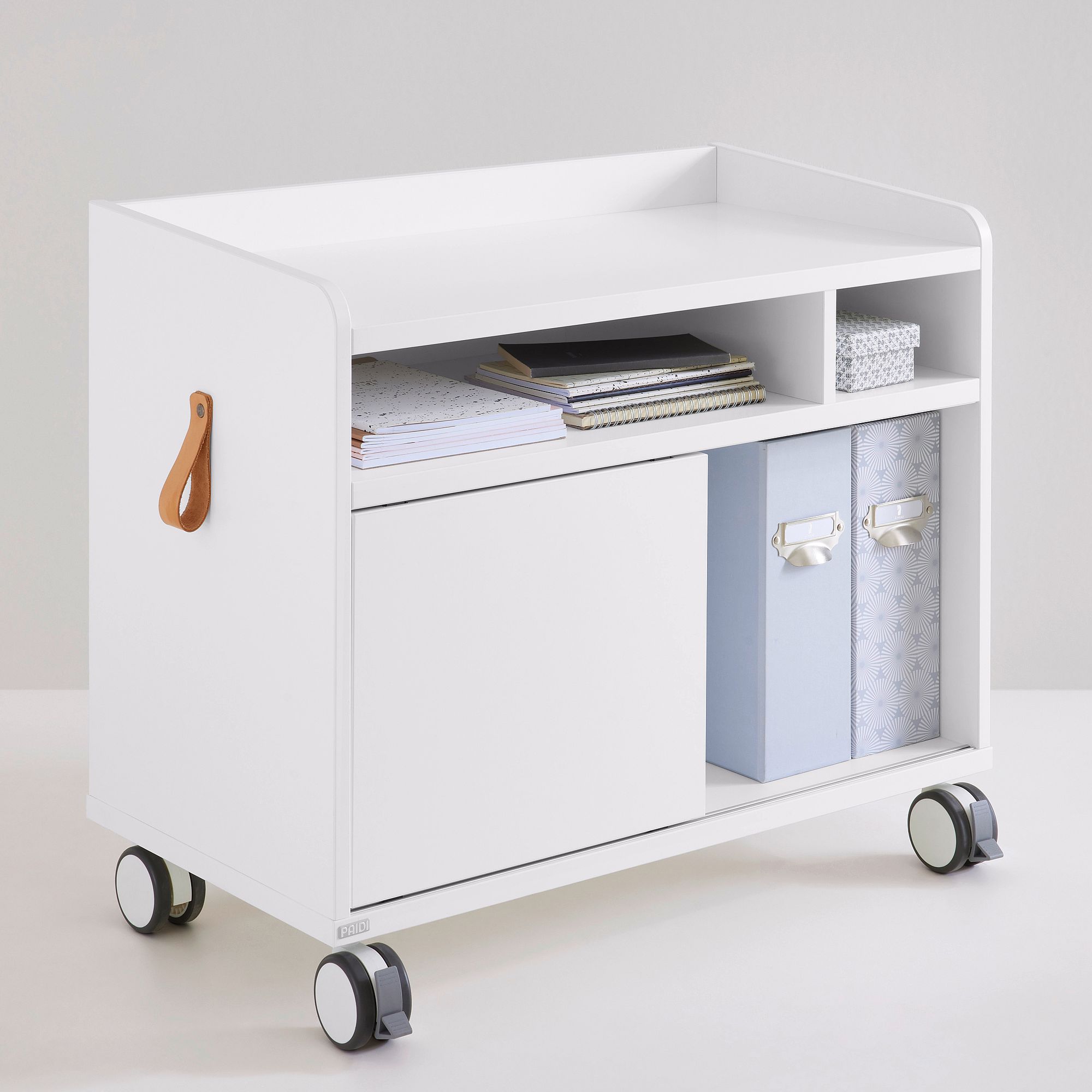 White rolling storage cart with shelves, bins, and a leather handle on the side.