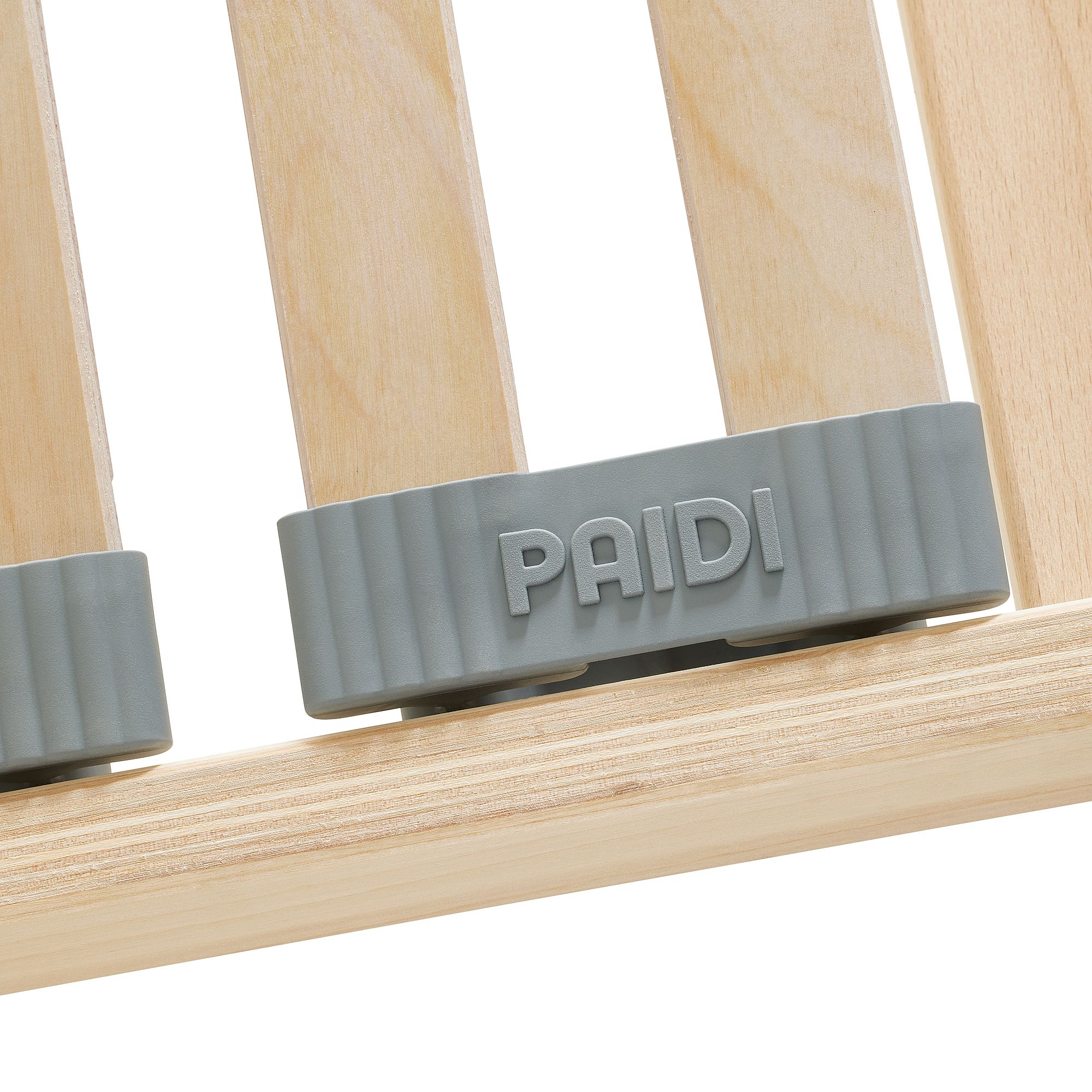 Lattenrost  Comfort mit Härteverstellung in 120 x 200 cm Graues Kunststoffteil mit der Aufschrift PAIDI auf hellen Holzlatten.