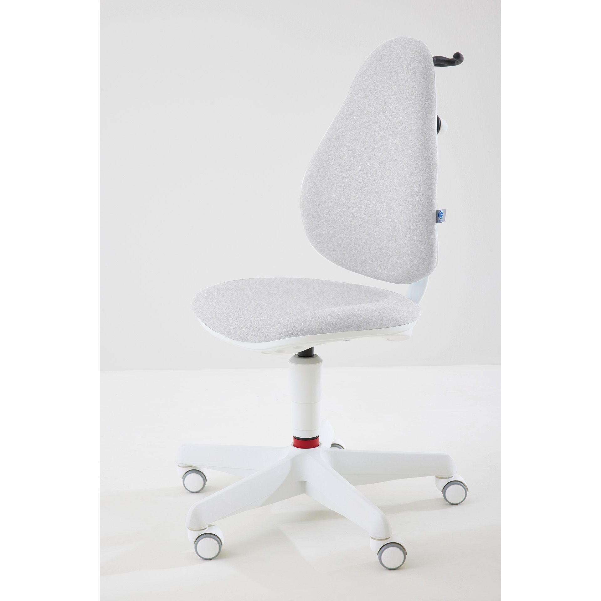 White ergonomic office chair with wheels, viewed from the side against a white background.