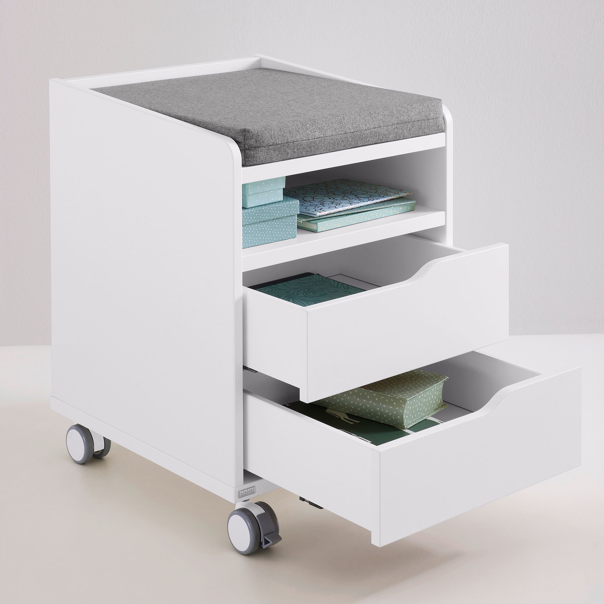 Rollcontainer  mit 2 Schubladen in Kreideweiß Weißer rollender Aufbewahrungswagen mit Regalen, Schubladen und einer grauen gepolsterten Platte.